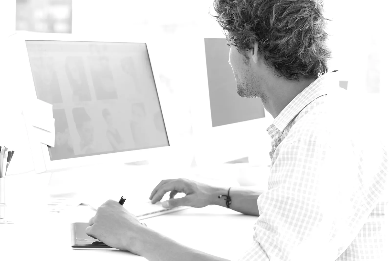 side-view-of-a-male-artist-drawing-somet